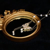 Elegant Silver Butterfly Necklace with Faux Pearls