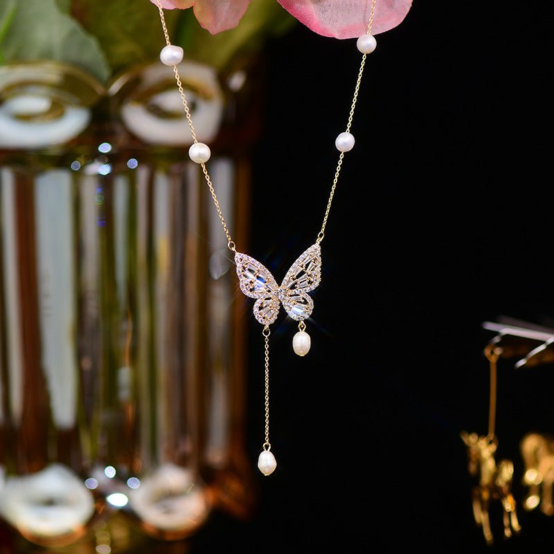 Elegant Silver Butterfly Necklace with Faux Pearls