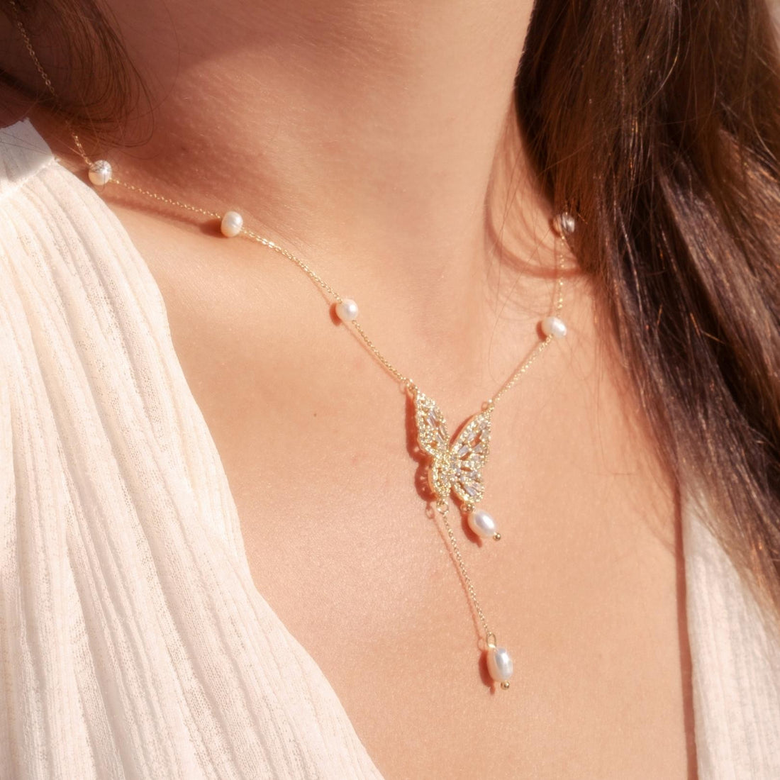 Elegant Silver Butterfly Necklace with Faux Pearls