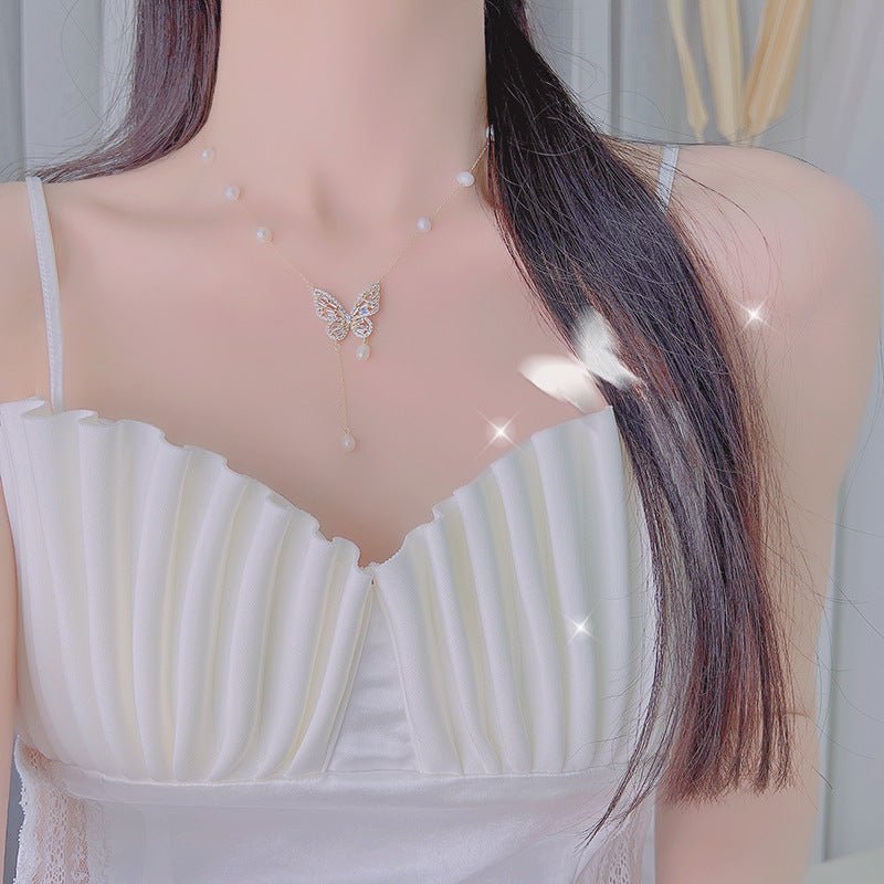 Elegant Silver Butterfly Necklace with Faux Pearls