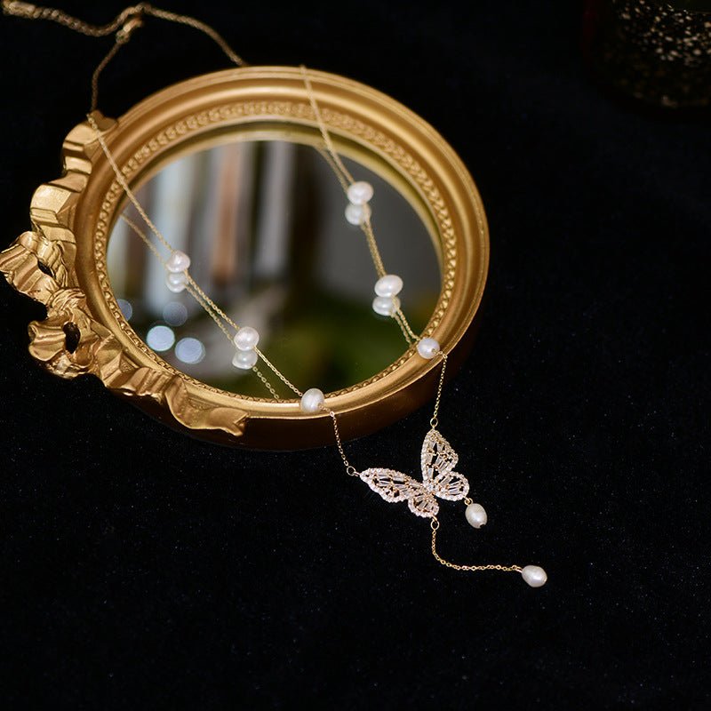 Elegant Silver Butterfly Necklace with Faux Pearls