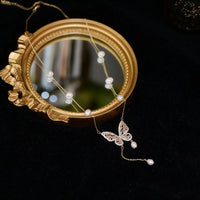 Elegant Silver Butterfly Necklace with Faux Pearls